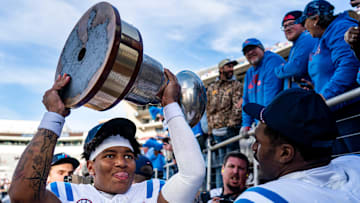 Ole Miss quarterback Trinidad Chambliss (6) raises the Golden Egg trophy after a college football game between Mississippi State and Ole Miss at Davis Wade Stadium in Starkville, Miss., on Friday, Nov. 28, 2025. Ole Miss defeated Mississippi State 38-19 in the Egg Bowl.