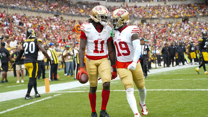 Sep 10, 2023; Pittsburgh, Pennsylvania, USA; San Francisco 49ers wide receiver Deebo Samuel (19) congratulates San Francisco 49ers wide receiver Brandon Aiyuk (11) for catching a touchdown pass against the Pittsburgh Steelers during the first half at Acrisure Stadium. Mandatory Credit: Gregory Fisher-USA TODAY Sports