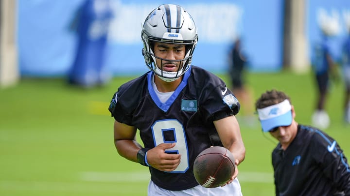 Jul 24, 2024; Charlotte, NC, USA; Carolina Panthers quarterback Bryce Young (9) hands the ball off at Carolina Panthers Practice Fields. Mandatory Credit: Jim Dedmon-USA TODAY Sports