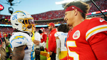 Oct 22, 2023; Kansas City, Missouri, USA; Los Angeles Chargers cornerback Asante Samuel Jr. (26) talks with Kansas City Chiefs quarterback Patrick Mahomes (15) after a game at GEHA Field at Arrowhead Stadium. Mandatory Credit: Jay Biggerstaff-Imagn Images