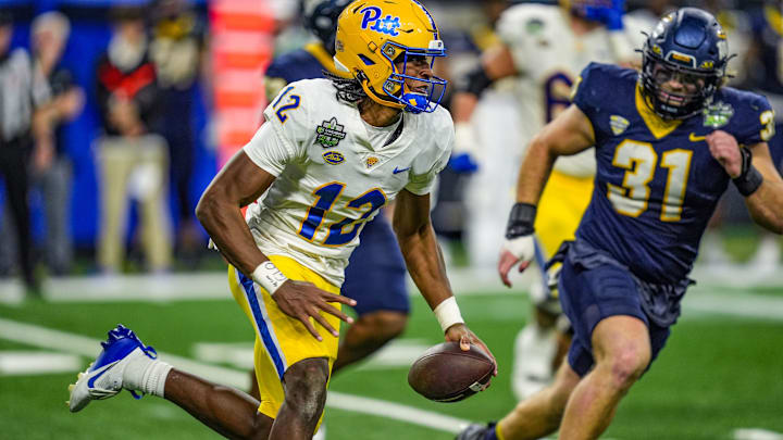 Pittsburgh Panthers quarterback Julian Dugger (12) escapes the pocket and runs during the second half of the 2024 GameAbove Sports Bowl at Ford Field in Detroit, on Thursday, Dec. 26, 2024. Pittsburgh Panthers quarterback Julian Dugger (12) escapes the pocket and runs during the second half of the 2024 GameAbove Sports Bowl at Ford Field in Detroit, on Thursday, Dec. 26, 2024.
