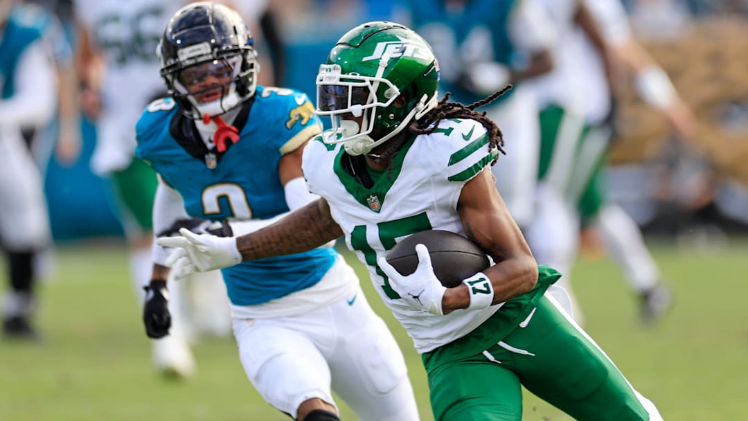 New York Jets wide receiver Davante Adams (17) rushes for yards against Jacksonville Jaguars cornerback Tyson Campbell (3) during the third quarter Sunday, Dec. 15, 2024 at EverBank Stadium in Jacksonville, Fla. The Jets held off the Jaguars 32-25. [Corey Perrine/Florida Times-Union]