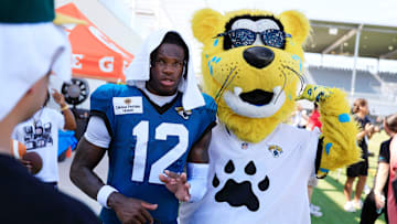 Jacksonville Jaguars wide receiver Travis Hunter is seen with team mascot Jaxson de Ville after an NFL training camp.