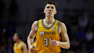 Missouri Tigers forward Caleb Grill (31) runs down the court on offense, in a game versus the Florida Gators this season.