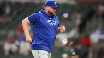 Sep 7, 2024; Atlanta, Georgia, USA; Toronto Blue Jays manager John Schneider (14) makes a pitching change against the Atlanta Braves in the ninth inning at Truist Park. Mandatory Credit: Brett Davis-Imagn Images