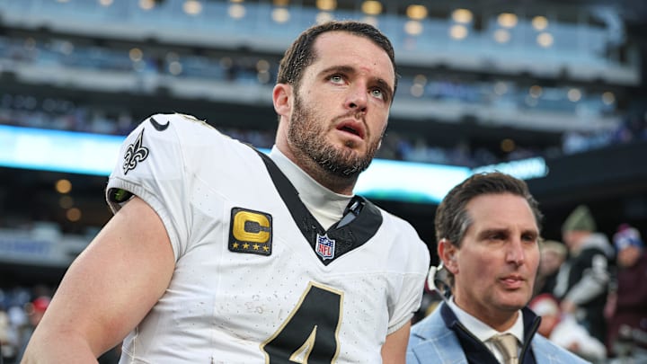 Dec 8, 2024; East Rutherford, New Jersey, USA; New Orleans Saints quarterback Derek Carr (4) walks off the field after field after an injury during the fourth quarter at MetLife Stadium. Mandatory Credit: Vincent Carchietta-Imagn Images