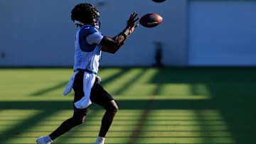 Jacksonville Jaguars wide receiver Travis Hunter catches a pass during an NFL training camp session.