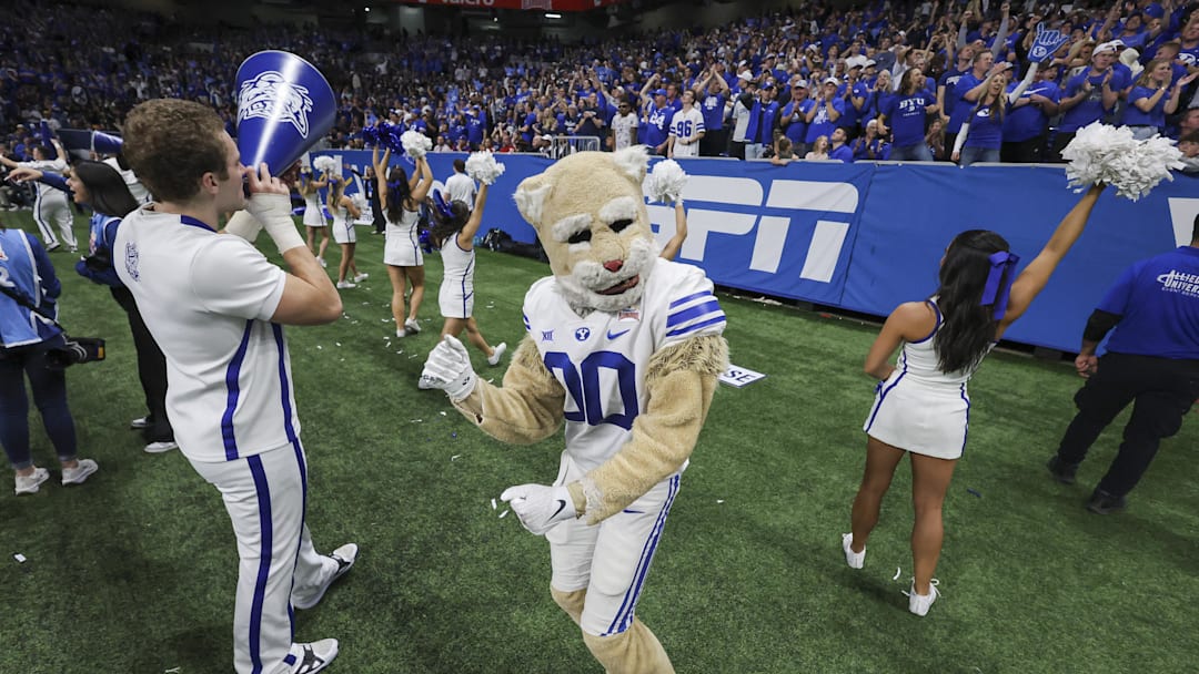 Dec 28, 2024; San Antonio, TX, USA; Brigham Young Cougars mascot Cosmo dances on the sideline during the fourth quarter of the game against the Colorado Buffaloes at Alamodome. Mandatory Credit: Troy Taormina-Imagn Images Dec 28, 2024; San Antonio, TX, USA; Brigham Young Cougars mascot Cosmo dances on the sideline during the fourth quarter of the game against the Colorado Buffaloes at Alamodome. Mandatory Credit: Troy Taormina-Imagn Images