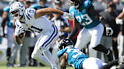 Indianapolis Colts wide receiver Michael Pittman Jr. (11) escapes Jacksonville Jaguars cornerback Montaric Brown (30) during the fourth quarter of an NFL football matchup Sunday, Oct. 15, 2023 at EverBank Stadium in Jacksonville, Fla. The Jacksonville Jaguars defeated the Indianapolis Colts 37-20. [Corey Perrine/Florida Times-Union]