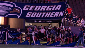 Dec 19, 2024; New Orleans, LA, USA; The Georgia Southern Eagles run out during the start of the first half against the Sam Houston State Bearkats at Caesars Superdome. Mandatory Credit: Stephen Lew-Imagn Images