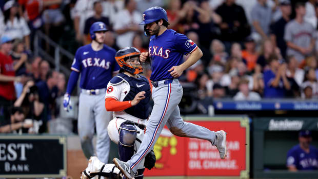 Josh Smith scores the go-ahead run on Nathaniel Lowe's single in the 10th in the Rangers 2-1 win over the Astros.