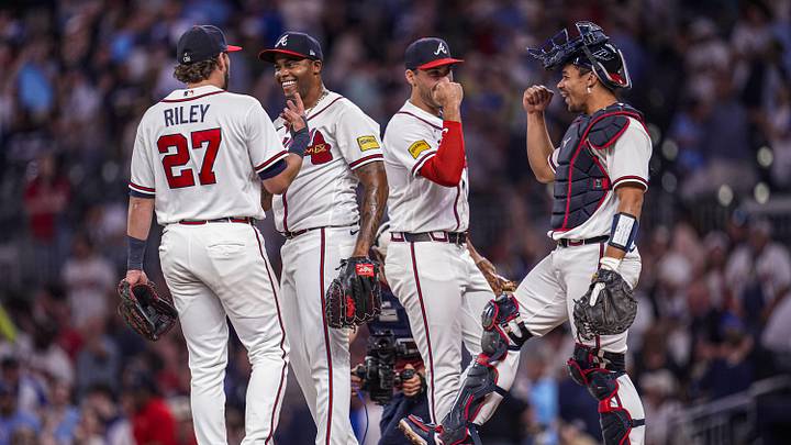 May 13, 2026; Cumberland, Georgia, USA; Atlanta Braves third baseman Austin Riley (27) pitcher Raisel Iglesias (26) first baseman Matt Olson (28) and catcher Drake Baldwin (30) react after defeating the Chicago Cubs at Truist Park. Mandatory Credit: Dale Zanine-Imagn Images