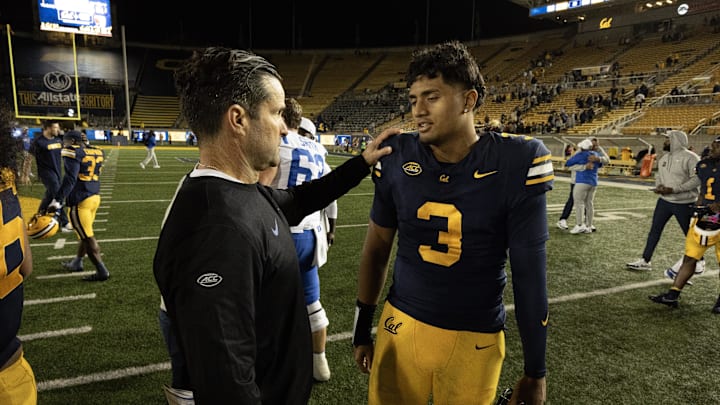 Duke head coach Manny Diaz talks to Cal quarterback Jaron-Keawe Sagapolutele after the game Duke head coach Manny Diaz talks to Cal quarterback Jaron-Keawe Sagapolutele after the game
