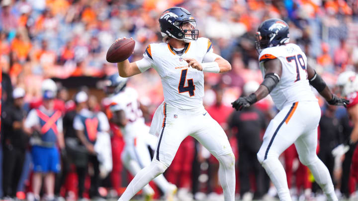 Aug 25, 2024; Denver, Colorado, USA; Denver Broncos quarterback Zach Wilson (4) prepares to pass in the second quarter against the Arizona Cardinals at Empower Field at Mile High.