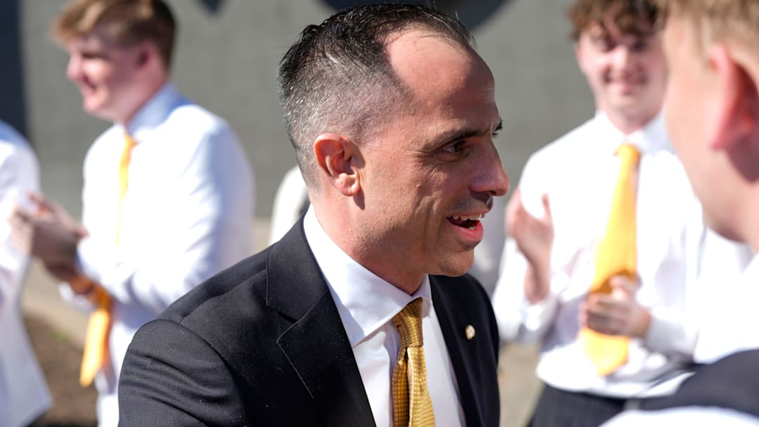 Iowa's new head men's basketball coach Ben McCollum walks into his introductory press conference Tuesday, March 25, 2025 at Carver-Hawkeye Arena in Iowa City, Iowa.