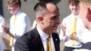 Iowa's new head men's basketball coach Ben McCollum walks into his introductory press conference Tuesday, March 25, 2025 at Carver-Hawkeye Arena in Iowa City, Iowa.
