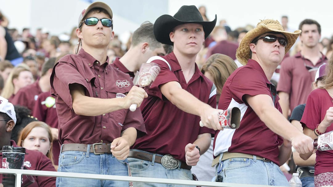 Sep 16, 2017; Starkville, MS, USA; Mississippi State Bulldogs fans ring cowbells before the game against the LSU Tigers at Davis Wade Stadium. Mandatory Credit: Matt Bush-Imagn Images