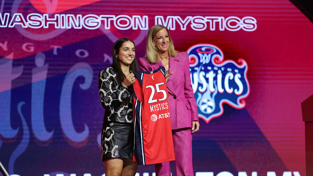 Apr 14, 2025; New York, New York, USA; Georgia Amoore poses with WNBA commissioner Cathy Engelbert after being selected with the number six overall pick to the Washington Mystics in the 2025 WNBA Draft at The Shed at Hudson Yards. Mandatory Credit: Vincent Carchietta-Imagn Images 