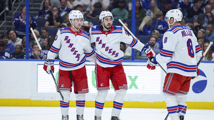 Apr 15, 2026; Tampa, Florida, USA; New York Rangers center Mika Zibanejad (93) (center) reacts with left wing Alexis Lafrenière (13) (left) and center J.T. Miller (8) (right) after scoring a goal against the Tampa Bay Lightning in the second period at Benchmark International Arena. Mandatory Credit: Nathan Ray Seebeck-Imagn Images