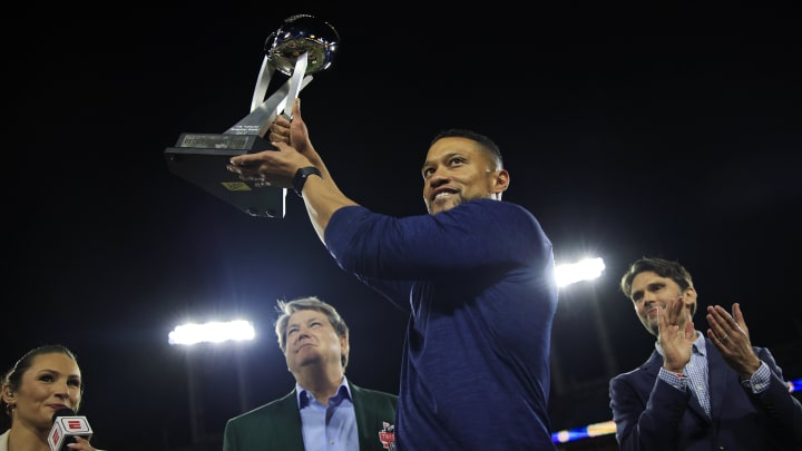 Notre Dame Fighting Irish head coach Marcus Freeman holds up the Ash Verlander Champions Trophy after the game of the TaxSlayer Gator Bowl of an NCAA college football game Friday, Dec. 30, 2022 at TIAA Bank Field in Jacksonville. The Notre Dame Fighting Irish held off the South Carolina Gamecocks 45-38. [Corey Perrine/Florida Times-Union