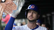 Oct 2, 2025; Chicago, Illinois, USA; Chicago Cubs outfielder Kyle Tucker (30) is greeted in the dugout after scoring against the San Diego Padres during game three of the Wildcard round for the 2025 MLB playoffs at Wrigley Field. Mandatory Credit: David Banks-Imagn Images