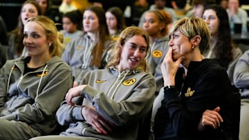Iowa Lucy Olsen and Head Coach Jan Jensen talk during a watch party for the the NCAA Women’s Basketball Tournament bracket reveal Sunday, March 16, 2025 at Carver-Hawkeye Arena in Iowa City, Iowa.