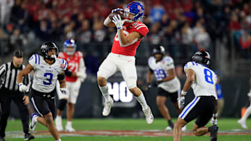 Mississippi Rebels tight end Caden Prieskorn (86) hauls in a reception between Duke Blue Devils linebacker Alex Howard (3) and safety DaShawn Stone (8) during the first quarter of the TaxSlayer Gator Bowl Thursday, Jan. 2, 2025 at EverBank Stadium in Jacksonville, Fla. [Corey Perrine/Florida Times-Union]