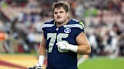 Sep 25, 2025; Glendale, Arizona, USA; Seattle Seahawks guard Grey Zabel (76) against the Arizona Cardinals at State Farm Stadium. Mandatory Credit: Mark J. Rebilas-Imagn Images