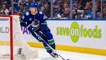 May 16, 2024; Vancouver, British Columbia, CAN; Vancouver Canucks defenseman Nikita Zadorov (91) handles the puck against the Edmonton Oilers during the second period in game five of the second round of the 2024 Stanley Cup Playoffs at Rogers Arena. Mandatory Credit: Bob Frid-USA TODAY Sports