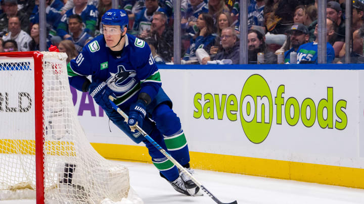 May 16, 2024; Vancouver, British Columbia, CAN; Vancouver Canucks defenseman Nikita Zadorov (91) handles the puck against the Edmonton Oilers during the second period in game five of the second round of the 2024 Stanley Cup Playoffs at Rogers Arena. Mandatory Credit: Bob Frid-USA TODAY Sports