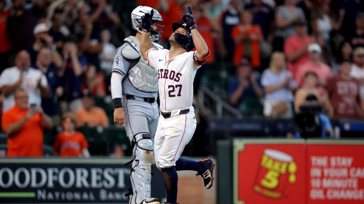 Aug 18, 2024; Houston, Texas, USA; Houston Astros designated hitter Jose Altuve (27) crosses home plate after hitting a home run to left field against the Chicago White Sox during the eighth inning at Minute Maid Park.