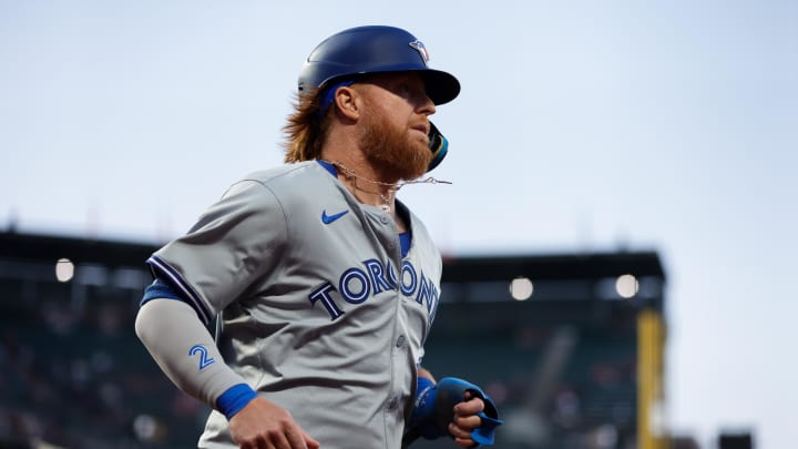 Jul 10, 2024; San Francisco, California, USA; Toronto Blue Jays first baseman Justin Turner (2) scores a run during the sixth inning against the San Francisco Giants at Oracle Park. Mandatory Credit: Sergio Estrada-USA TODAY Sports