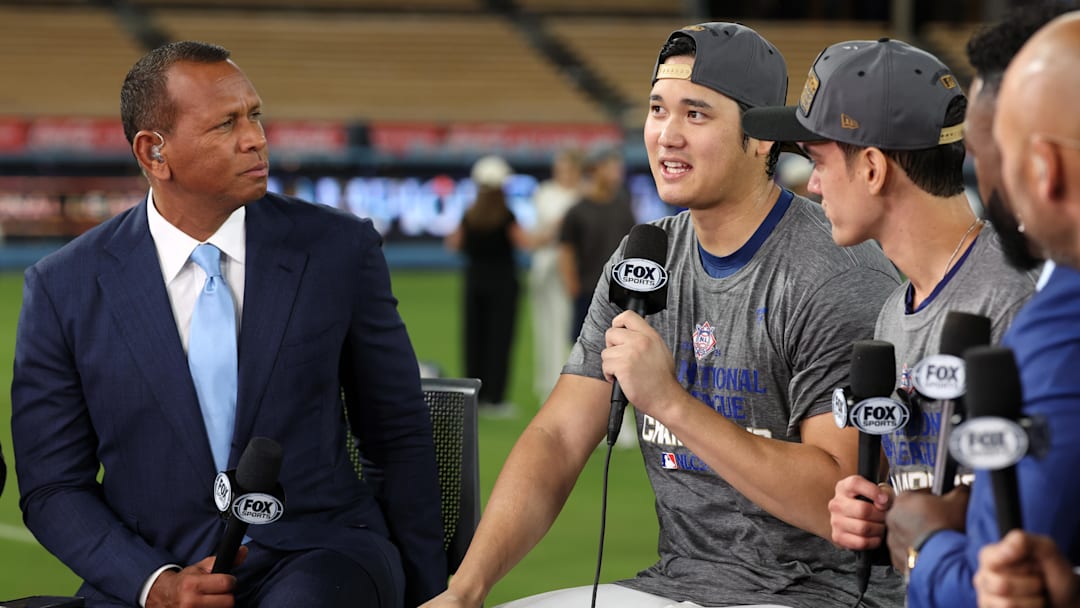 Oct 20, 2024; Los Angeles, California, USA; Fox Sports broadcasters David Ortiz and Alex Rodriguez talk with Los Angeles Dodgers designated hitter Shohei Ohtani (17) and his interpreter Will Ireton after the Los Angeles Dodgers defeated the New York Mets in game six of the NLCS to advance to the World Series in the 2024 MLB playoffs at Dodger Stadium. Mandatory Credit: Kiyoshi Mio-Imagn Images Oct 20, 2024; Los Angeles, California, USA; Fox Sports broadcasters David Ortiz and Alex Rodriguez talk with Los Angeles Dodgers designated hitter Shohei Ohtani (17) and his interpreter Will Ireton after the Los Angeles Dodgers defeated the New York Mets in game six of the NLCS to advance to the World Series in the 2024 MLB playoffs at Dodger Stadium. Mandatory Credit: Kiyoshi Mio-Imagn Images