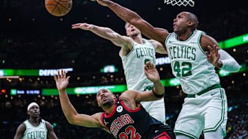 Dec 19, 2024; Boston, Massachusetts, USA; Boston Celtics center Al Horford (42) and center Kristaps Porzingis (8) defend against Chicago Bulls forward Talen Horton-Tucker (22) in the second half at TD Garden. Mandatory Credit: David Butler II-Imagn Images