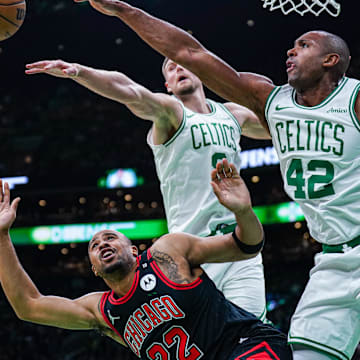 Dec 19, 2024; Boston, Massachusetts, USA; Boston Celtics center Al Horford (42) and center Kristaps Porzingis (8) defend against Chicago Bulls forward Talen Horton-Tucker (22) in the second half at TD Garden. Mandatory Credit: David Butler II-Imagn Images