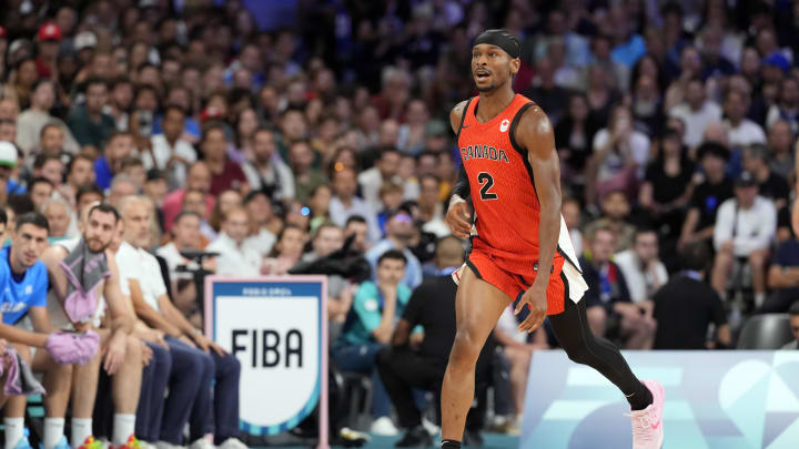 Jul 27, 2024; Villeneuve-d'Ascq, France; Canada guard Shai Gilgeous-Alexander (2) controls the ball against Greece in the first quarter during the Paris 2024 Olympic Summer Games at Stade Pierre-Mauroy. Mandatory Credit: John David Mercer-USA TODAY Sports