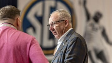 Oct 14, 2025; Birmingham, AL, USA;  SEC commissioner Greg Sankey talks with staff before SEC Media Days at Grand Bohemian Hotel. Mandatory Credit: Vasha Hunt-Imagn Images