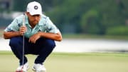 Xander Schauffele lines up his putt on the 8th green during the final round of the 2023 Tour Championship at East Lake Golf Club.