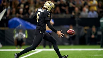 Saints' Thomas Morstead (6) punts the ball away against Indianapolis Colts. 
