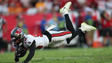 Oct 12, 2025; Tampa, Florida, USA; Tampa Bay Buccaneers wide receiver Tez Johnson (15) dives for a touchdown during the third quarter against the San Francisco 49ers at Raymond James Stadium. Mandatory Credit: Nathan Ray Seebeck-Imagn Images