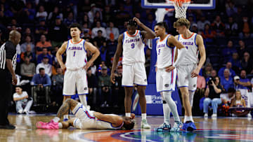 Jan 14, 2025; Gainesville, Florida, USA; Florida Gators guard Alijah Martin (15) lays on the floor while Florida Gators guard Walter Clayton Jr. (1), Florida Gators center Rueben Chinyelu (9), Florida Gators guard Will Richard (5) and Florida Gators forward Thomas Haugh (10) watch against the Missouri Tigers during the second half at Exactech Arena at the Stephen C. O'Connell Center. Mandatory Credit: Matt Pendleton-Imagn Images