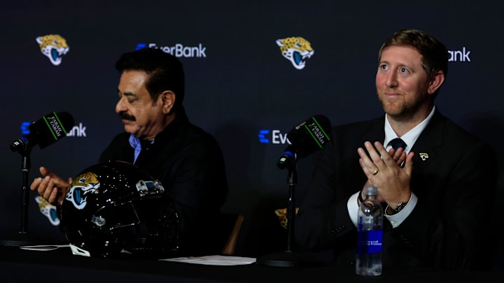 New Jacksonville Jaguars head coach Liam Coen, right, claps next to Jaguars owner Shad Khan after speaking and being introduced during a press conference Monday, Jan. 27, 2025 at the Miller Electric Center in Jacksonville, Fla. 