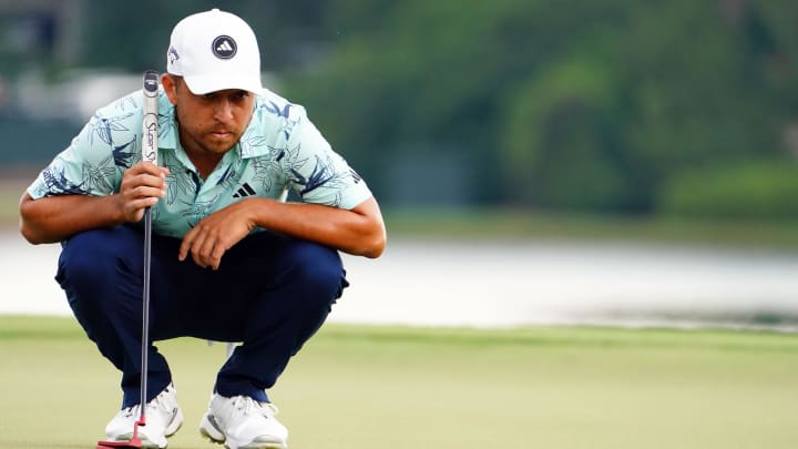 Xander Schauffele lines up his putt on the 8th green during the final round of the 2023 Tour Championship at East Lake Golf Club.