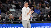 Mar 12, 2025; Charlotte, NC, USA; Stanford Cardinal head coach Kyle Smith applauds his team against the California Golden Bears during the first half at Spectrum Center. Mandatory Credit: Jim Dedmon-Imagn Images
