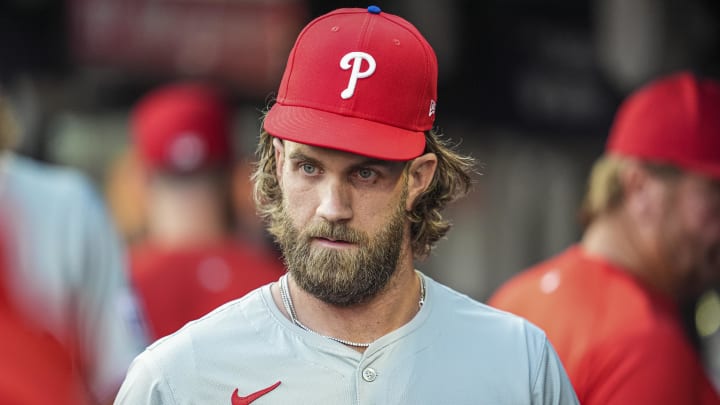 Aug 20, 2024; Cumberland, Georgia, USA; Philadelphia Phillies first baseman Bryce Harper (3) in the dugout prior to the game against the Atlanta Braves at Truist Park