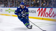 Nov 16, 2024; Vancouver, British Columbia, CAN; Vancouver Canucks forward J.T. Miller (9) handles the puck against the Chicago Blackhawks during the first period at Rogers Arena. Mandatory Credit: Bob Frid-Imagn Images