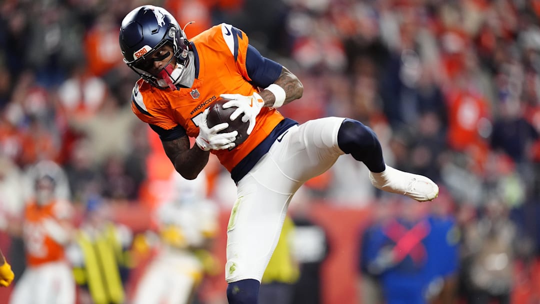 Dec 14, 2025; Denver, Colorado, USA: Denver Broncos wide receiver Troy Franklin (11) celebrates following a touchdown during the third quarter against the Green Bay Packers at Empower Field at Mile High. Mandatory Credit: Ron Chenoy-Imagn Images