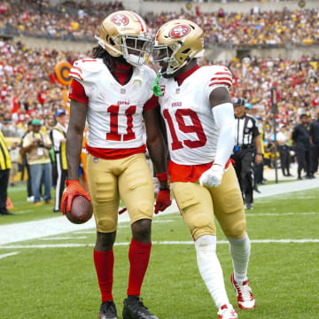 Sep 10, 2023; Pittsburgh, Pennsylvania, USA; San Francisco 49ers wide receiver Deebo Samuel (19) congratulates San Francisco 49ers wide receiver Brandon Aiyuk (11) for catching a touchdown pass against the Pittsburgh Steelers during the first half at Acrisure Stadium. Mandatory Credit: Gregory Fisher-USA TODAY Sports