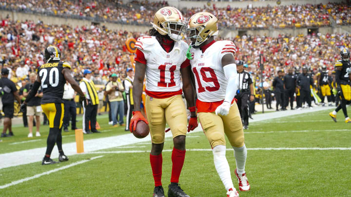 Sep 10, 2023; Pittsburgh, Pennsylvania, USA; San Francisco 49ers wide receiver Deebo Samuel (19) congratulates San Francisco 49ers wide receiver Brandon Aiyuk (11) for catching a touchdown pass against the Pittsburgh Steelers during the first half at Acrisure Stadium. Mandatory Credit: Gregory Fisher-USA TODAY Sports