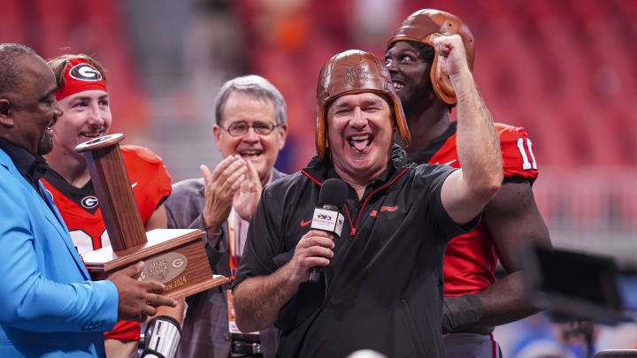 Aug 31, 2024; Atlanta, Georgia, USA; Georgia Bulldogs head coach Kirby Smart wears the old leather helmet after defeating the Clemson Tigers at Mercedes-Benz Stadium.